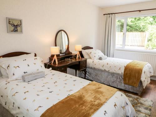 Postel nebo postele na pokoji v ubytování Glebe Farm Cottage