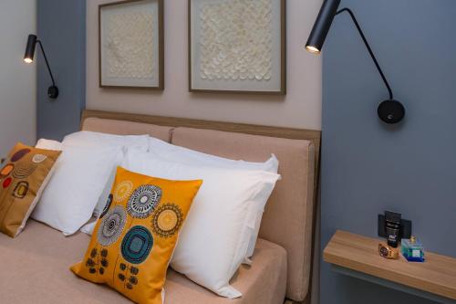 Postel nebo postele na pokoji v ubytování Macramè Fazello Rooms