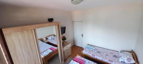 Un ou plusieurs lits dans un hébergement de l'établissement Rooms Vlaovic