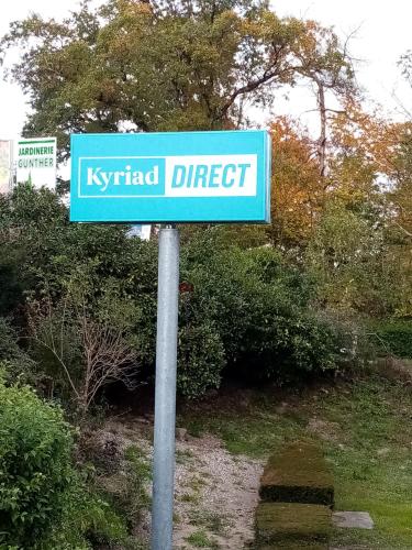 a blue street sign with the words kqv direct at Kyriad Direct Haguenau in Haguenau