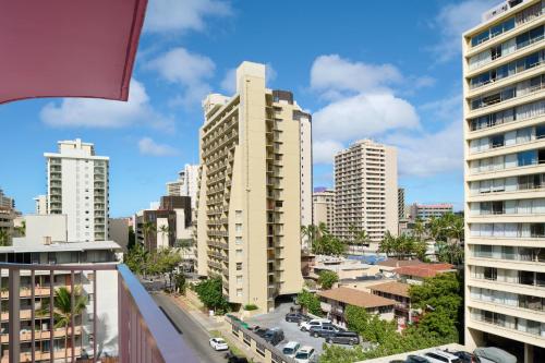 a view of a city skyline with tall buildings at Ilima Hotel in Honolulu