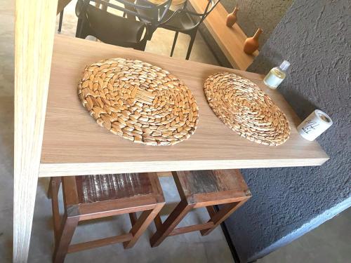 two straw hats sitting on top of a table at 7 ESTRELAS PATACHO in Pôrto de Pedras