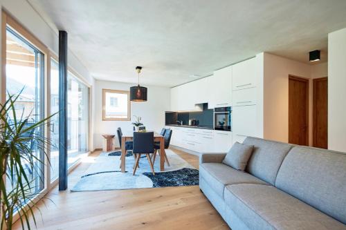 a living room with a couch and a table at ROTUND-Nature_Mountain_Living in Tubre