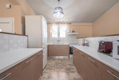 a kitchen with a sink and a counter top at Castle's Nest 1 in Kástro Tornéze
