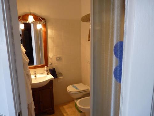a bathroom with a toilet and a sink at Apartment Vatican Vista in Rome