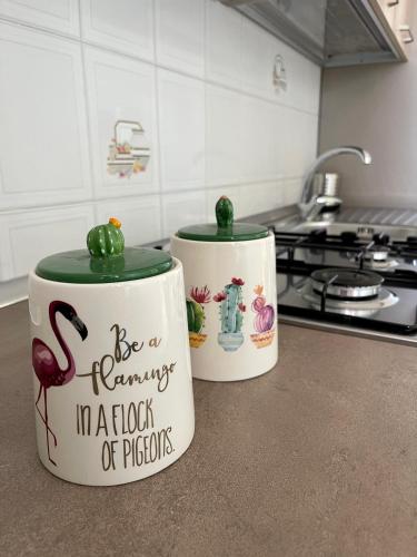 two canisters sitting on a counter in a kitchen at Villa Patty in Marzamemi