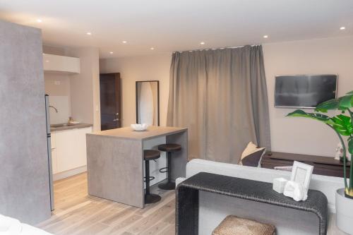 a living room with a couch and a table at Tradewinds Apartments Simpson Bay in Simpson Bay