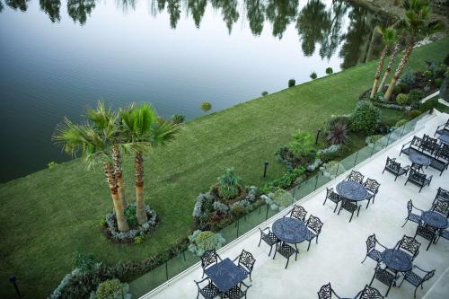 an overhead view of tables and chairs next to the water at Radisson Collection Morina Hotel, Tirana in Tirana