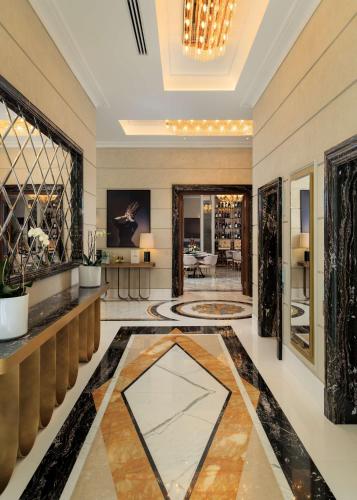 a lobby of a hotel with a large room at Radisson Collection Morina Hotel, Tirana in Tirana