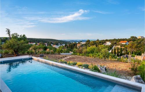 a swimming pool with a view of a city at 3 Bedroom Nice Home In Zman in Žman