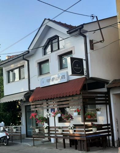 a building with a sign that reads first opportunity ministries at Fiori Apartment in Gevgelija