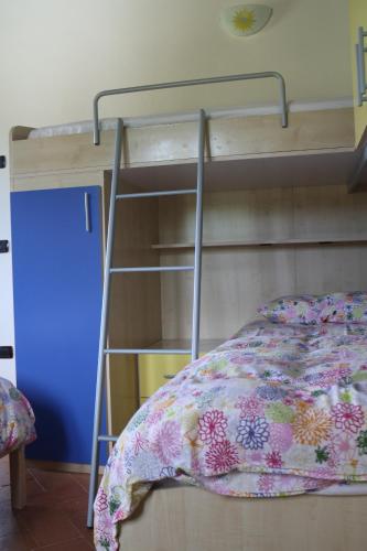 a bunk bed in a room with a bedspread at Antica Dimora Italiana in Fabriano