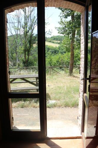 an open window with a view of a field at Antica Dimora Italiana in Fabriano