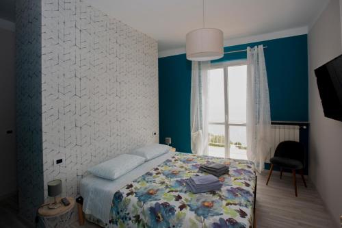 Ένα ή περισσότερα κρεβάτια σε δωμάτιο στο Villa Giò - Terrazza nel Blu