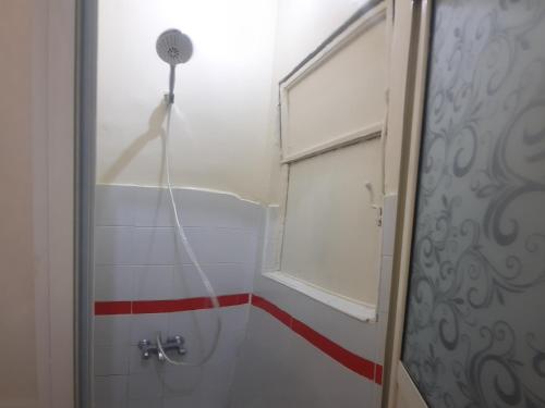 a shower in a bathroom with a shower curtain at happy life hostel in Cairo