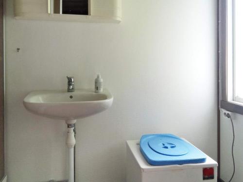 a bathroom with a sink and a toilet at Holiday home LULEÅ in Luleå