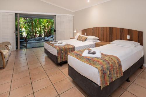 Ένα ή περισσότερα κρεβάτια σε δωμάτιο στο Eco Village Mission Beach