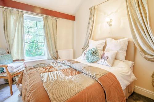 Säng eller sängar i ett rum på Ash Cottage