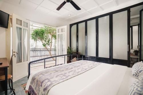 Katil atau katil-katil dalam bilik di Brown Feather Hotel