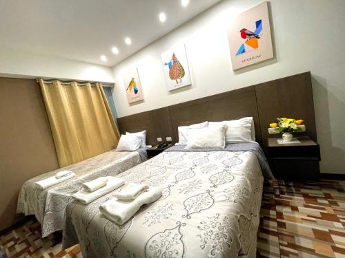 A bed or beds in a room at Hotel Suite Terrazzo