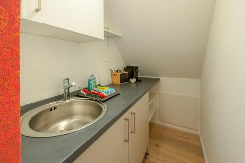 a bathroom with a sink and a counter at Gästehaus am Schlossplatz, Z. 5 in Meersburg