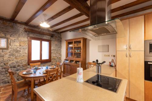 a kitchen and dining room with a table and chairs at Erribera - baskeyrentals in Berriatúa