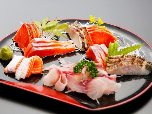 a plate of food with sushi on it at Oyado Fubuki in Nozawa Onsen