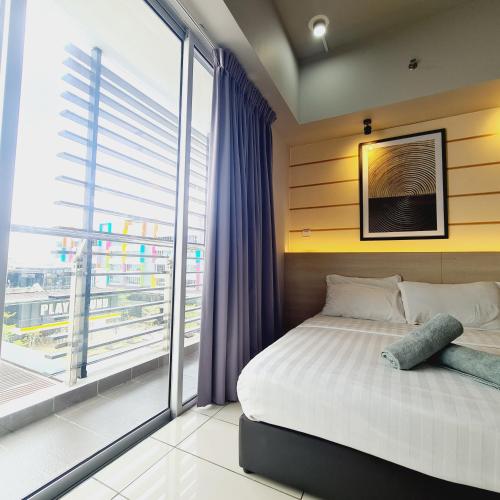 a bedroom with a bed and a large window at Aeropod 2 Queen Bed Near Airport & KK city Free Parking Netflix in Kota Kinabalu