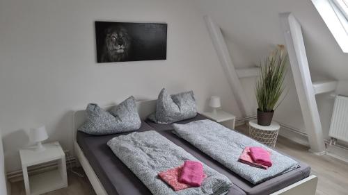 Кровать или кровати в номере Stadtnah an der Förde 75 3