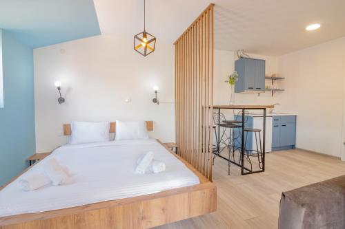 Postel nebo postele na pokoji v ubytování AGH Elite Apartments & Studios