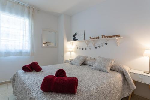 Кровать или кровати в номере Apartament Sant Antoni