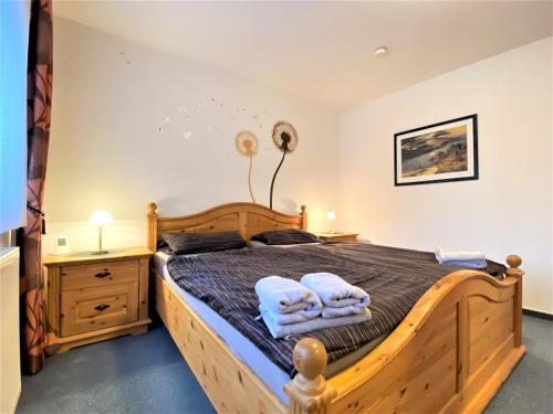 Postel nebo postele na pokoji v ubytování Haus Seebär Whg. 1 Hollwert 29a 70qm