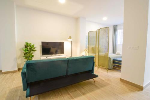 Televízia a/alebo spoločenská miestnosť v ubytovaní Salitre FreshApartments