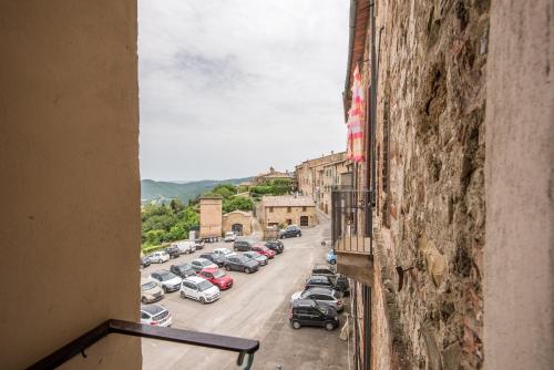 a view of a city street with cars parked at Radicondoli House in Radicondoli