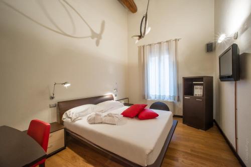 Postel nebo postele na pokoji v ubytování Hotel Annunziata