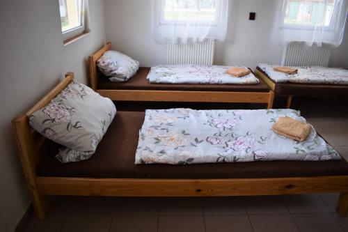 two beds with pillows on them in a room at Marina Týnec n. L. - Kemp in Týnec nad Labem