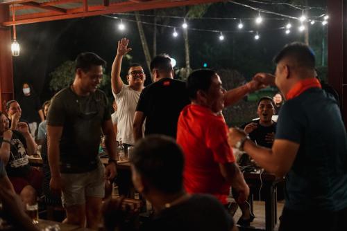 a group of people standing around in a crowd at Momarco Forest Cove in Tanay