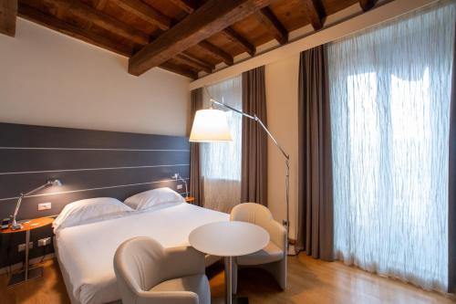 Postel nebo postele na pokoji v ubytování Hotel Annunziata