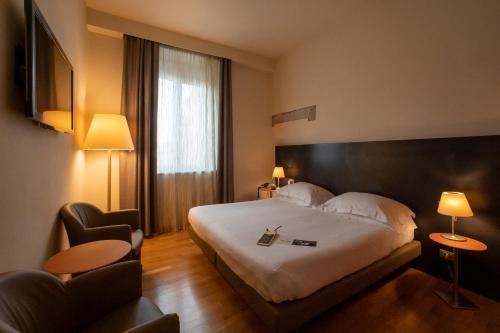Postel nebo postele na pokoji v ubytování Hotel Annunziata