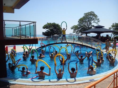 a group of people in the water at a water park at Kaliakra Beach Hotel - Ultra All Inclusive in Albena