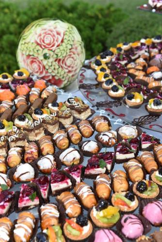 a bunch of different types of donuts on a table at Kaliakra Beach Hotel - Ultra All Inclusive in Albena