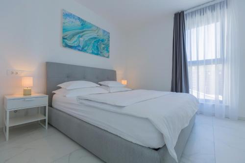 Postel nebo postele na pokoji v ubytování Villa Allegra Luxury Apartments