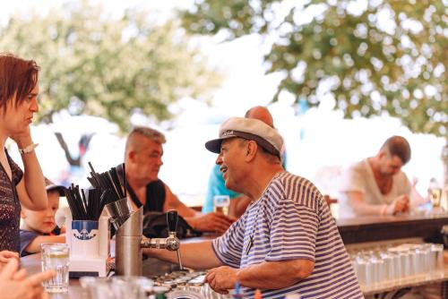 a group of people sitting at a table at Kaliakra Beach Hotel - Ultra All Inclusive in Albena