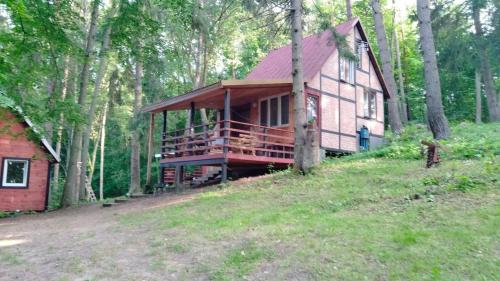 a large house in the middle of a forest at Oleandria- ,, Domek Malinka" nr 35 in Biskupiec
