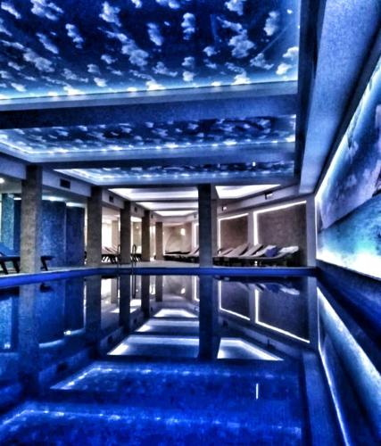 a swimming pool in a building with a star ceiling at Milmari S70 Kopaonik in Kopaonik