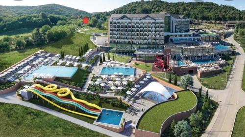 an aerial view of a resort with a water slide at Kula House Vrdnik in Vrdnik