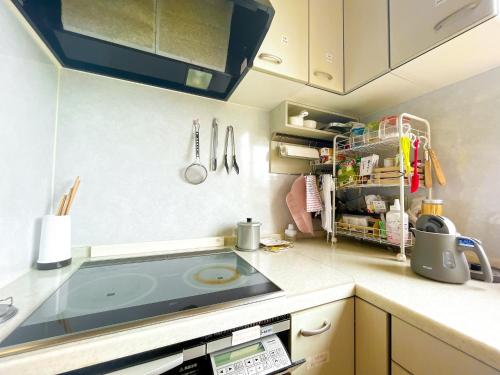 a kitchen with a sink and a counter top at Crane in Kushiro