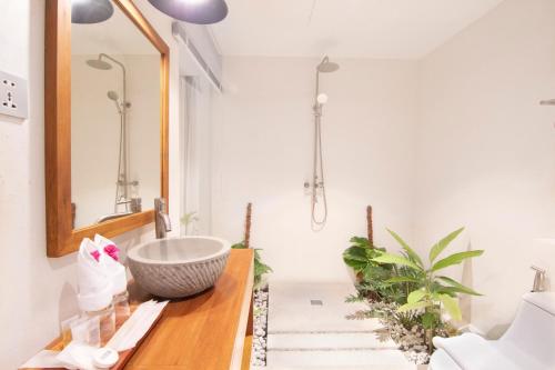 a bathroom with a sink and a mirror at The B Resort in Kampot