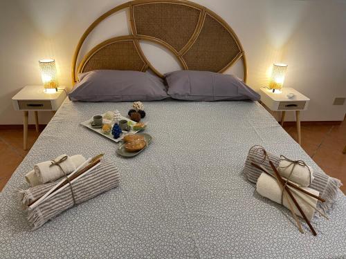 A bed or beds in a room at Casa vacanze Baglio Barcellona Mondello