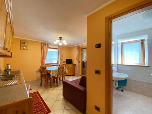 a living room with a couch and a table at Mountain Spirit Apartments in Livigno